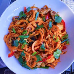 Chicken Pad Thai made with egg noodles, mushrooms, bell peppers, cilantro, and carrots