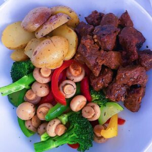 Oven Roasted Steak, served with roasted potatoes and mixed sautéed vegetables