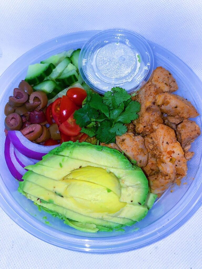 Souvlaki Greek Bowl. Made with basmati rice, olives, tomatoes, onions and cucumbers. Served with a side of tzatziki