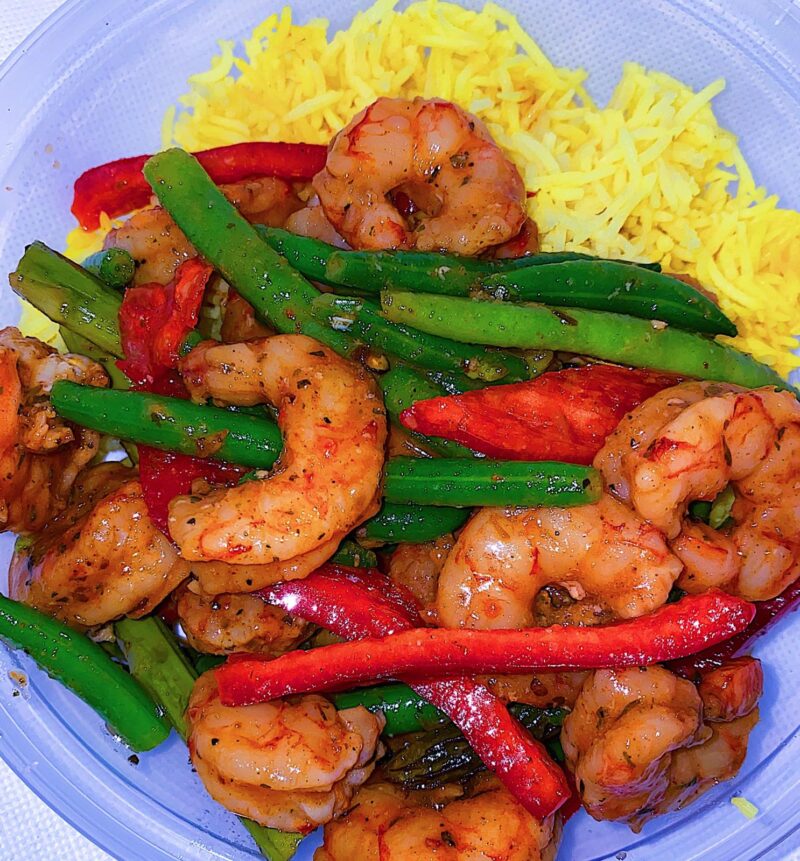 Spicy Honey Lime Shrimp, served with turmeric rice, green beans, and sweet bell peppers
